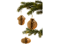 Brown paper Christmas decorations hanging from a green fir tree.