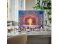 Advent calendar with toy figures and mini models on a table.