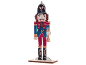 Wooden nutcracker figure in a blue and red uniform.