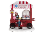 Christmas cotton candy cart with figures and a 'Rides 10¢' sign.