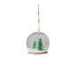 Christmas snow globe with trees and hanging string.