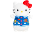 Plush cat toy with a red bow and a blue vest with patches.
