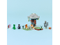 Toy building blocks set with figures, a tree, and a treasure chest on a light blue background.