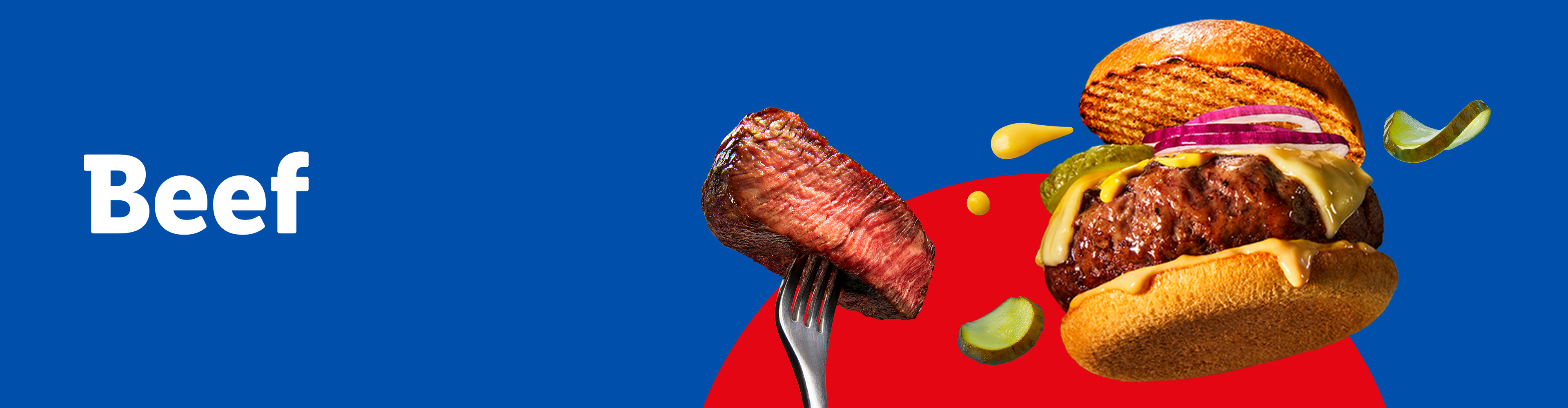 A burger with cheese, onions, and pickles, next to a steak on a fork.
