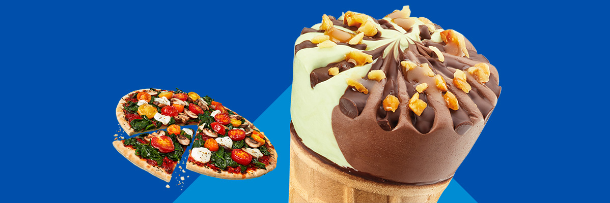 A pizza with vegetables and an ice cream cone with nuts and chocolate.