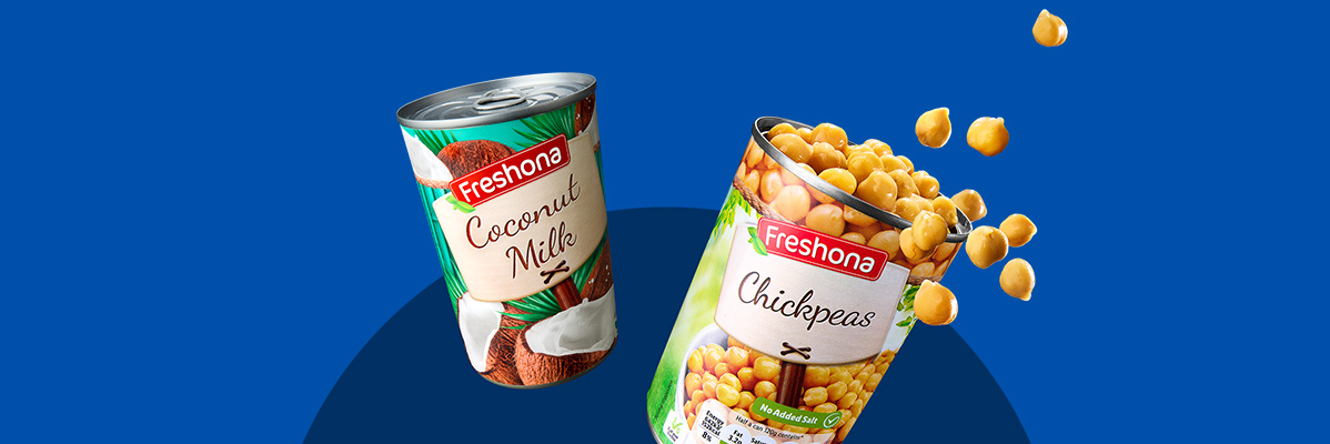 Two Freshona cans, one with coconut milk and the other with chickpeas, against a blue background.