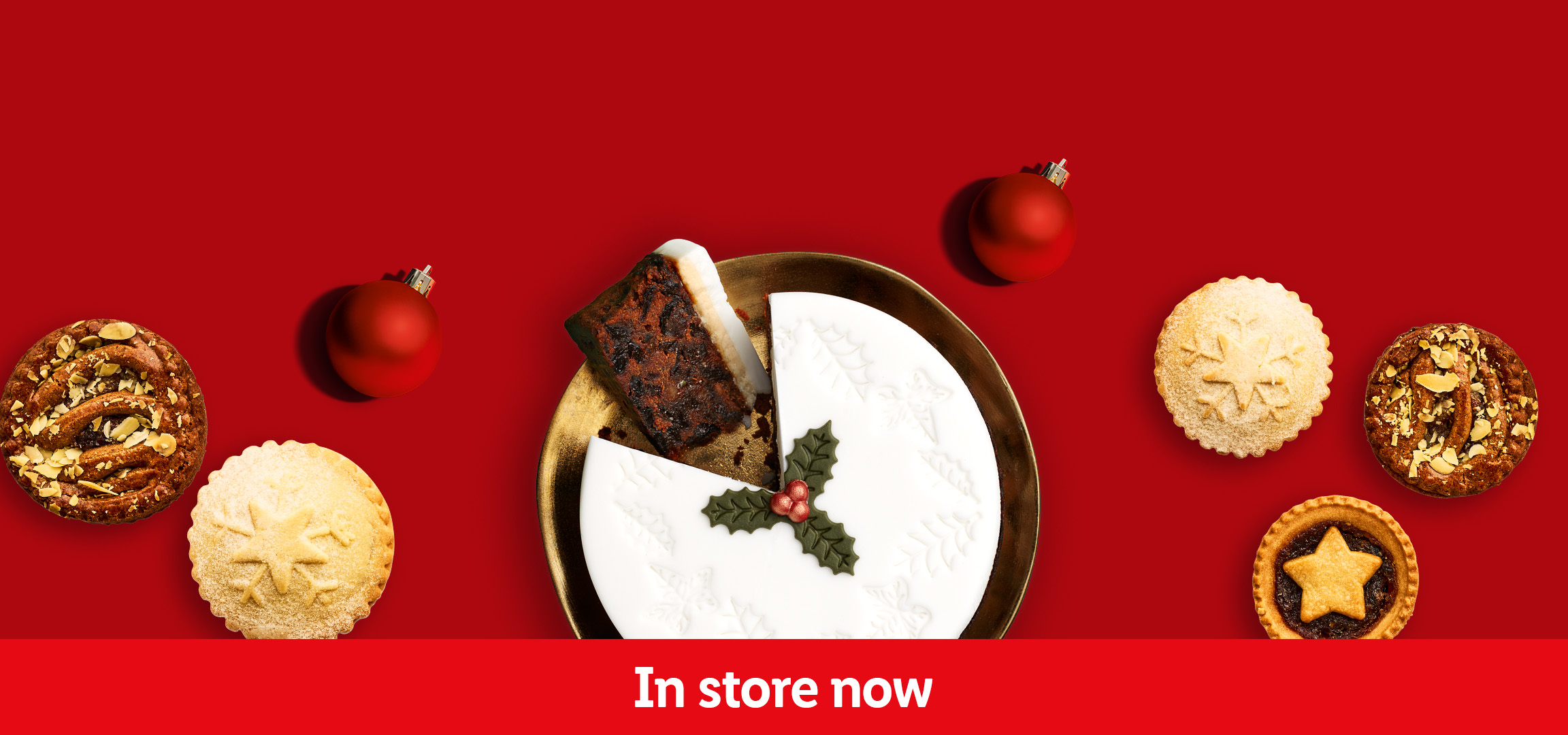 Christmas desserts: mince pies, tarts, and a festive fruit cake on a red background.