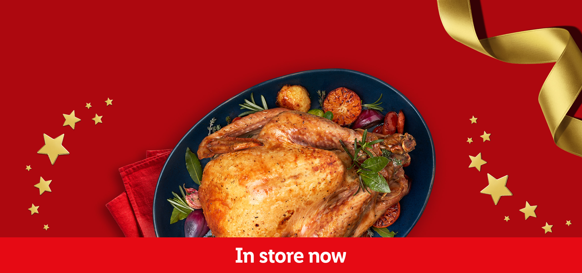 Festive roast turkey and golden roast potatoes on a red background with 'In store now' text.