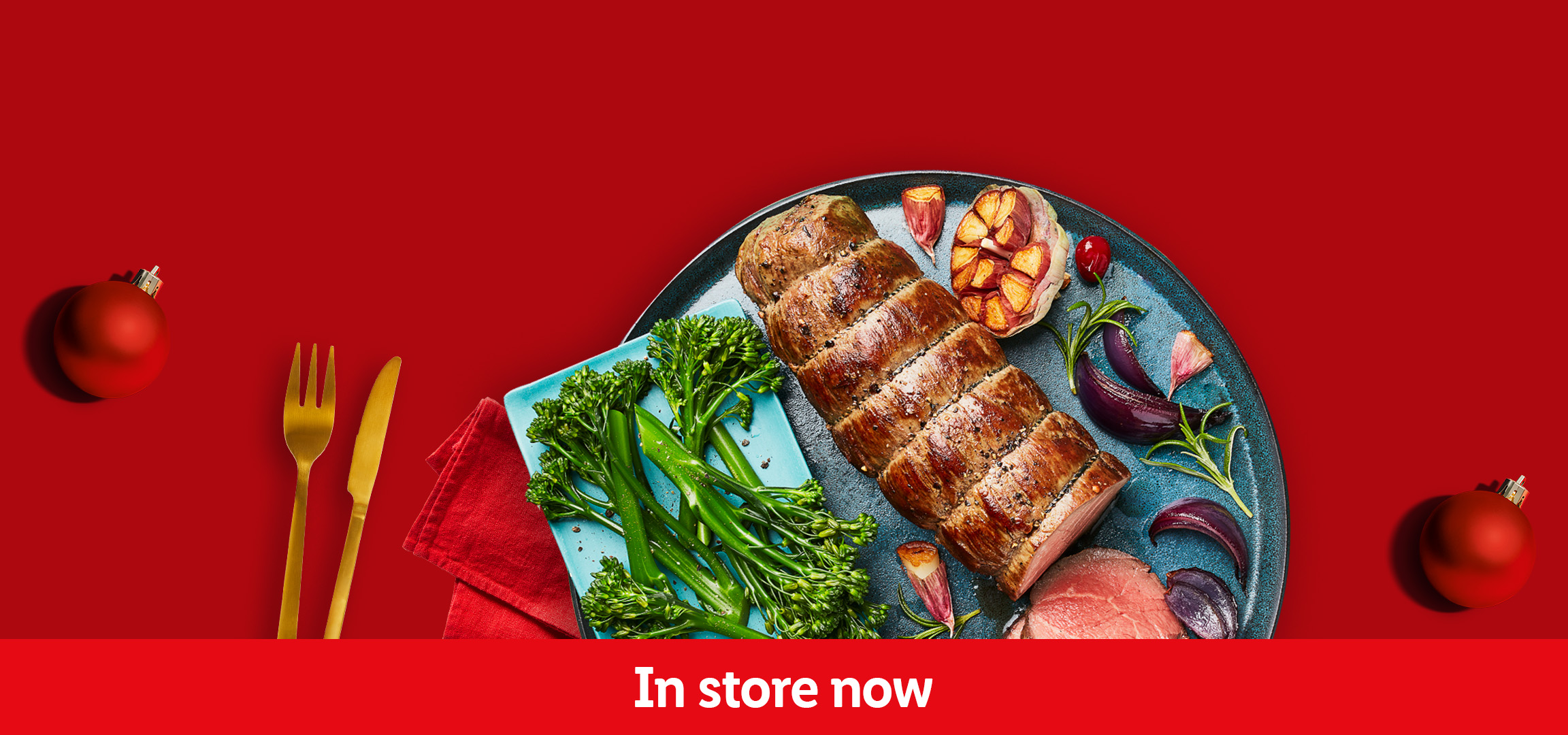 Christmas dinner with roasted meats, vegetables, and festive ornaments. In store now.