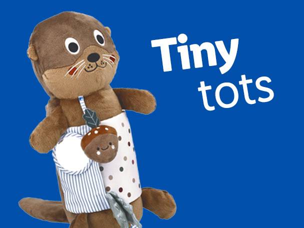 Brown otter plush toy with a patterned bib and an acorn rattle, next to 'Tiny tots' text.
