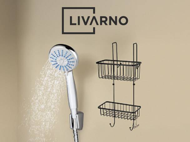 Shower head with water spraying and a two-tier hanging shower caddy.