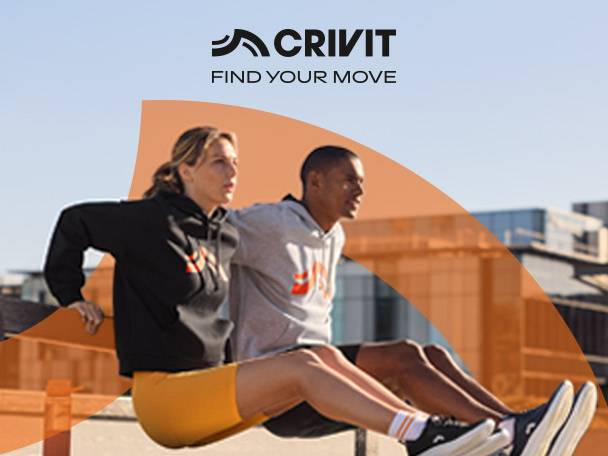 Two people in activewear, a woman in a black hoodie and yellow shorts, a man in a grey hoodie, exercising outdoors. Text: FIND YOUR MOVE.