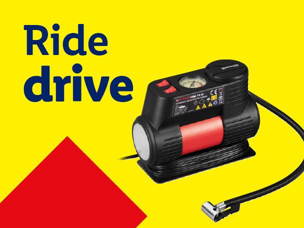A black and red portable air compressor on a yellow background with the text 'Ride drive'.