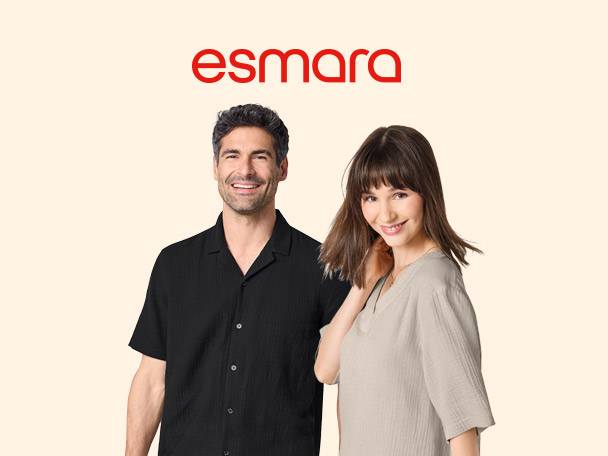 Smiling man in a black short-sleeved shirt and woman in a light-colored top.