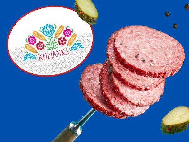 Kuljanka brand salami slices with pickles and peppercorns on a blue background.
