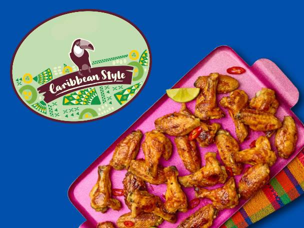 Caribbean-style chicken wings on a pink tray, with a logo featuring a toucan.