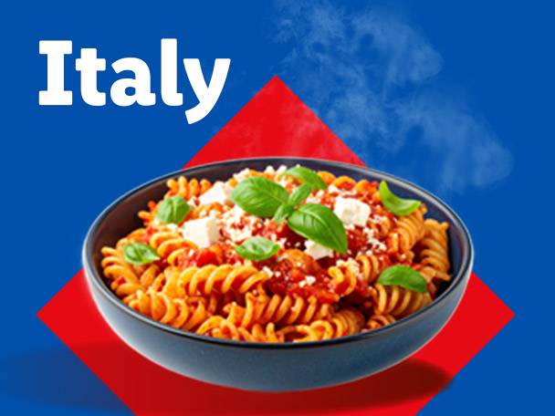 Bowl of fusilli pasta with tomato sauce, feta cheese, and basil, with 'Italy' text.