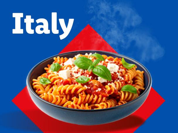 Bowl of fusilli pasta with tomato sauce, feta, and basil, with 'Italy' text on a blue and red background.