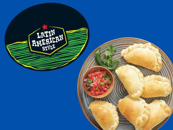 Latin American style empanadas served with salsa on a rustic plate.