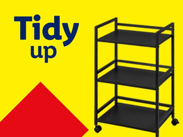 A black three-tier rolling cart on a yellow background with the text 'Tidy up'.