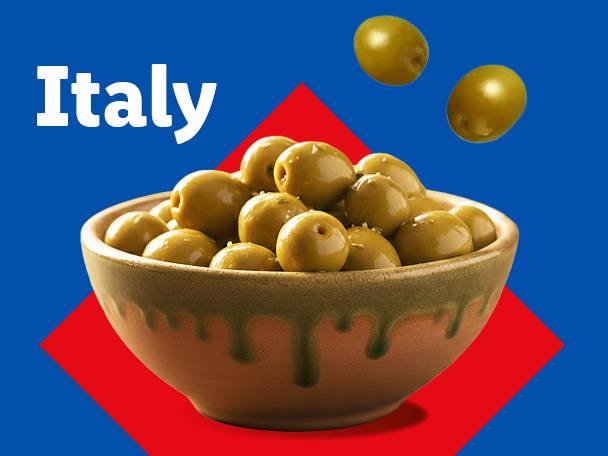A bowl of green olives with two olives floating above, set against a blue and red background with the word 'Italy'.