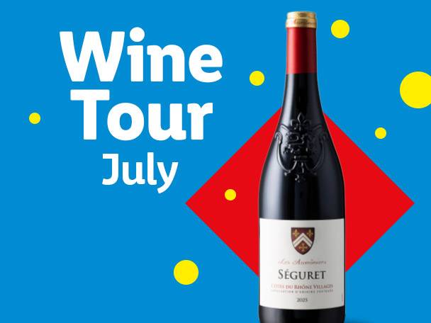 A bottle of red wine with a white label, on a blue background with red diamond and yellow dots. Text: Wine Tour July.