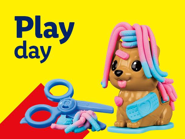 Play-Doh dog with colorful hair, blue scissors, and text 'Play day' on yellow background.
