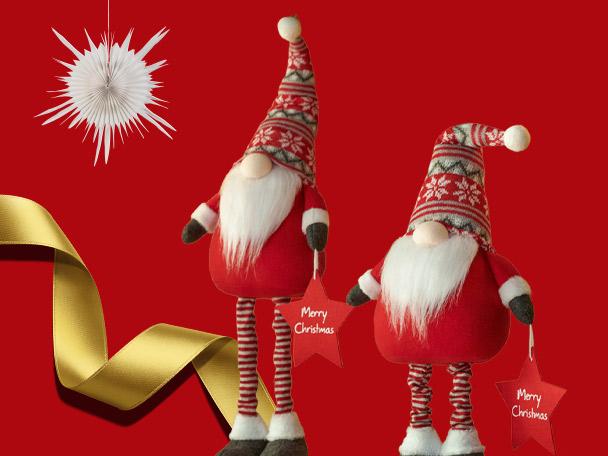 Two festive Christmas gnomes with red hats and striped legs holding Merry Christmas stars.