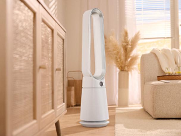 White bladeless tower fan in a modern, bright living room.