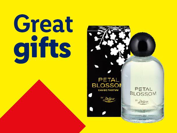 Perfume bottle and box with floral design on a yellow background with text 'Great gifts'.