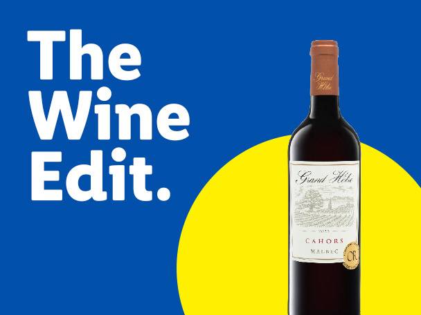 A bottle of red wine on a blue and yellow background with the text 'The Wine Edit.'
