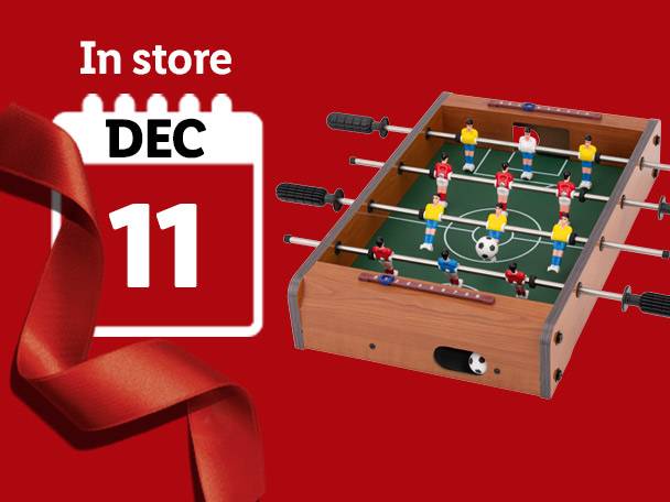 A foosball table and a calendar showing December 11, with a red ribbon.