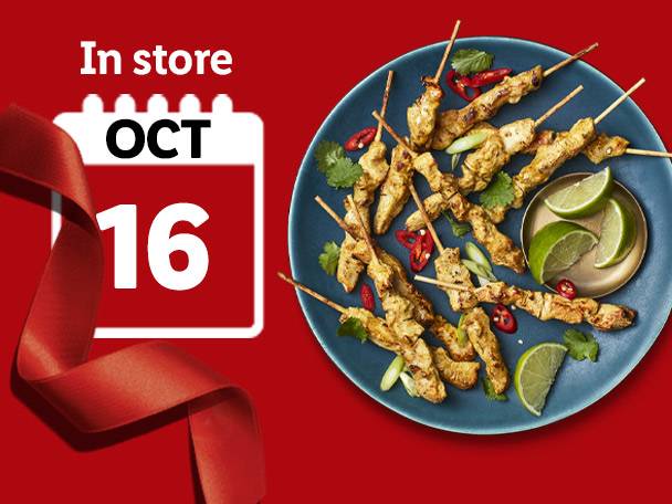 Chicken satay skewers with lime wedges on a blue plate, with an October 16th calendar icon.