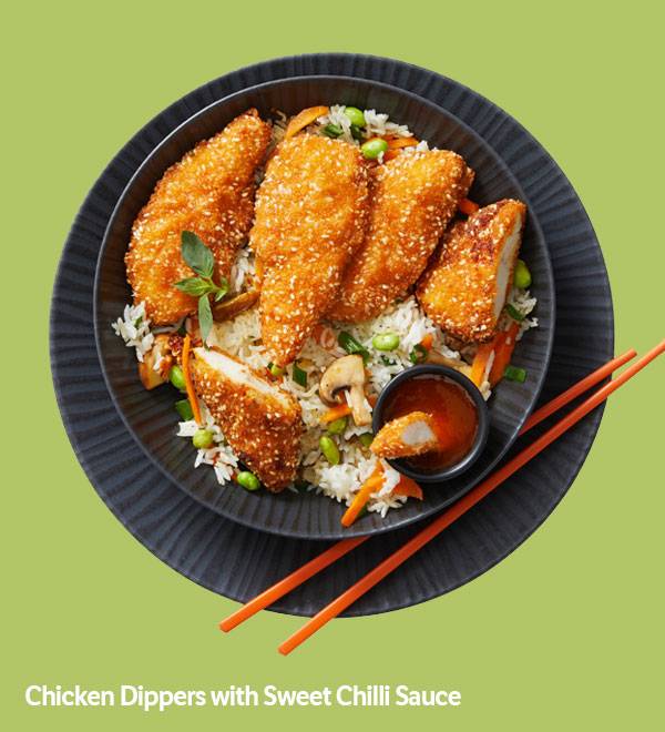 Chicken dippers served with rice, vegetables, and sweet chili sauce.