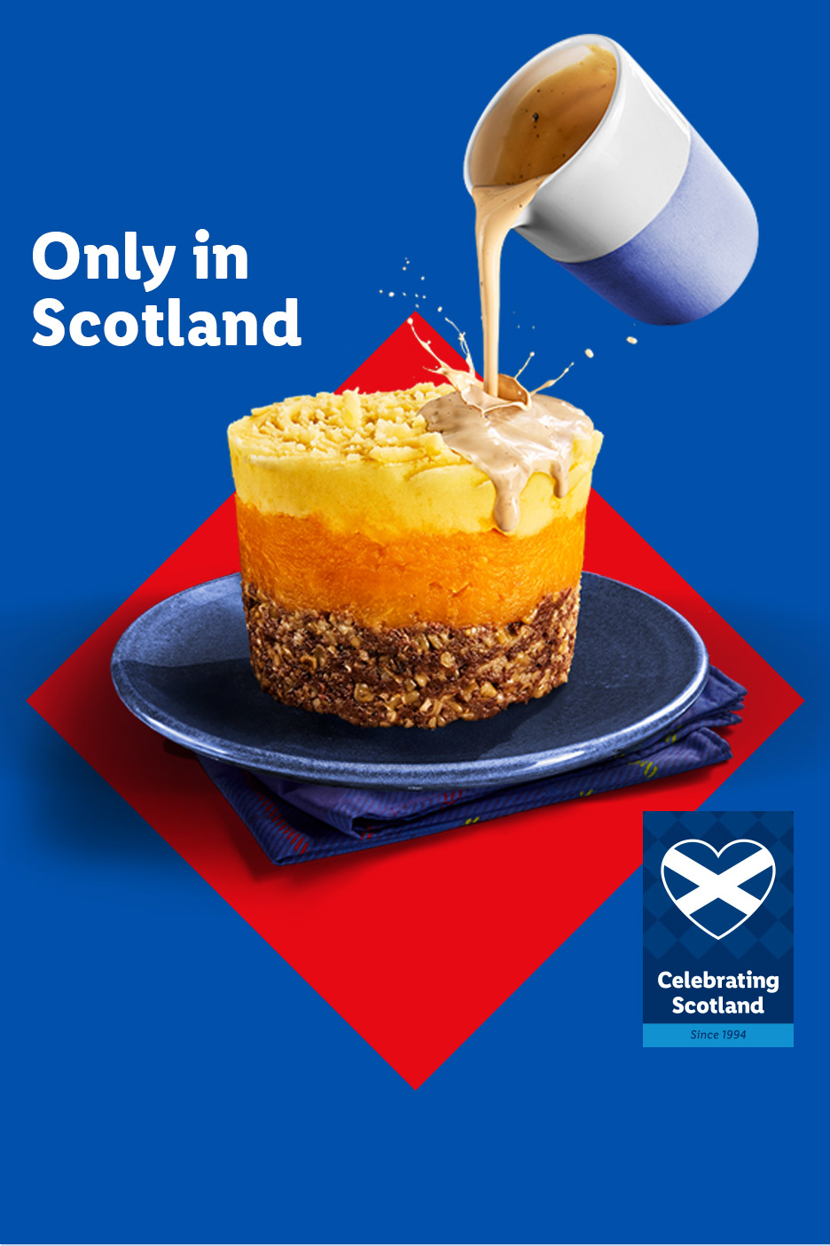 Haggis, neeps, and tatties with gravy, on a blue and red background, with text 'Only in Scotland'.