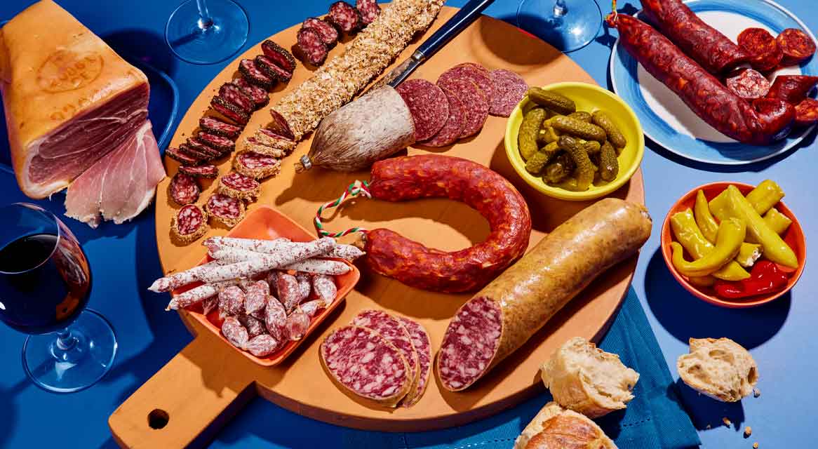 Iberian ham, salami, cheeses, and pickles.