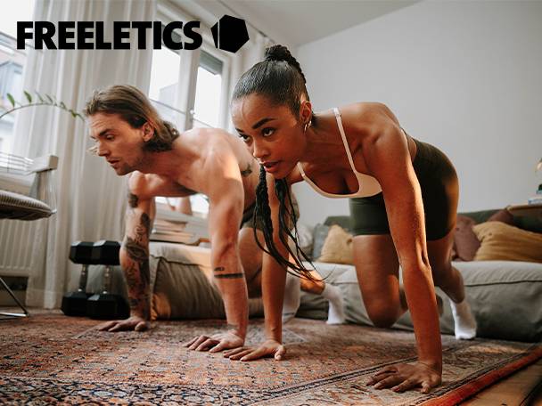 Two people in athletic wear doing a workout on a patterned rug at home.