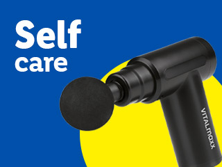 A black massage gun with “Self care” text on a blue and yellow background.