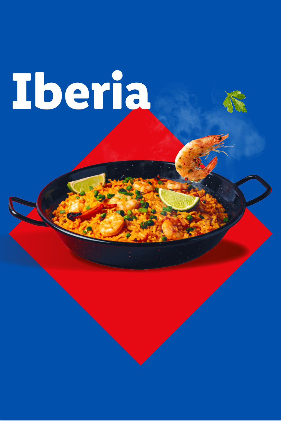 Paella with shrimp and lime in a black pan on a blue and red background.