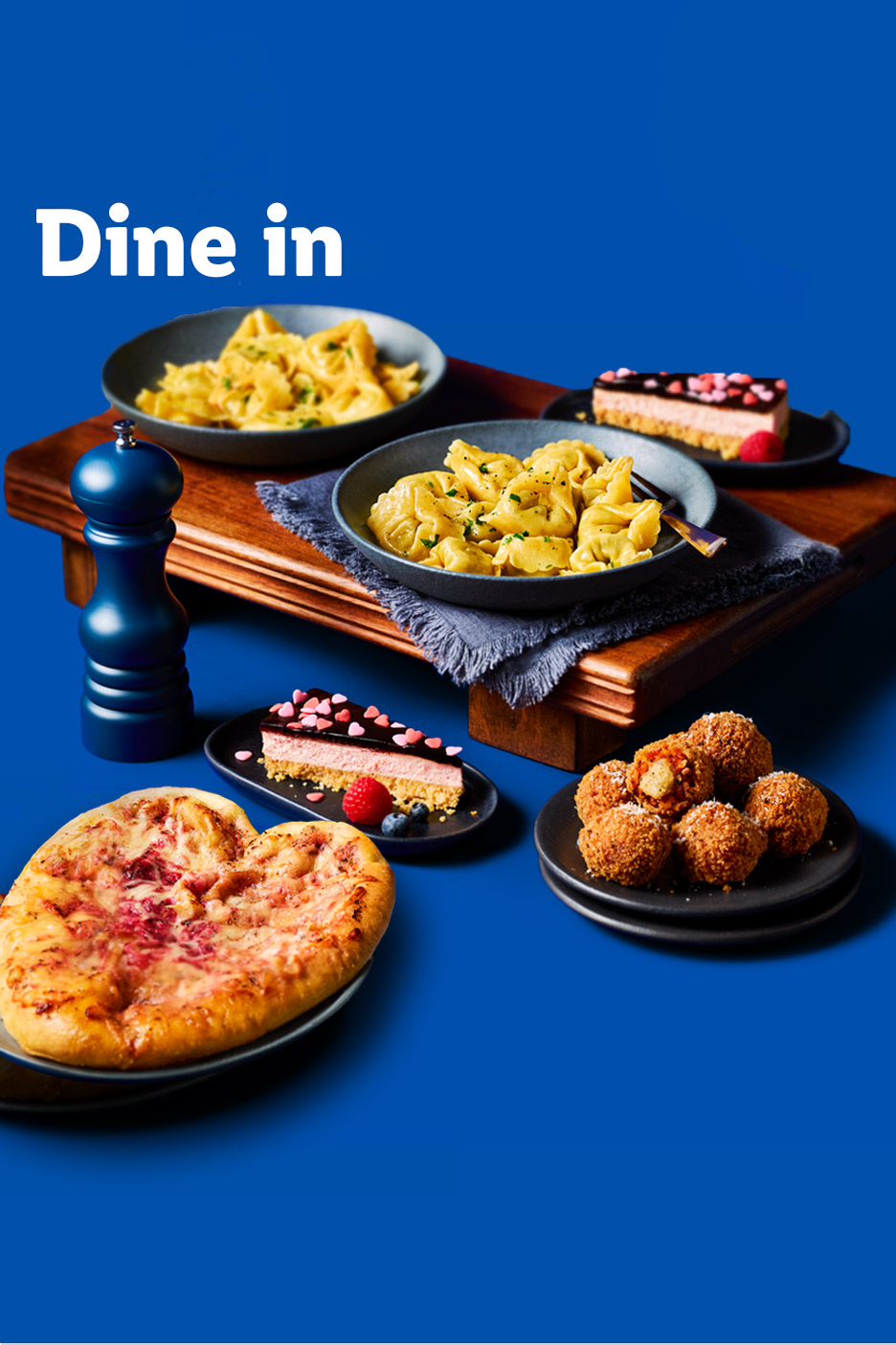 Dine in: pasta dishes, cheesecake, pizza, and fried snacks on a blue background.