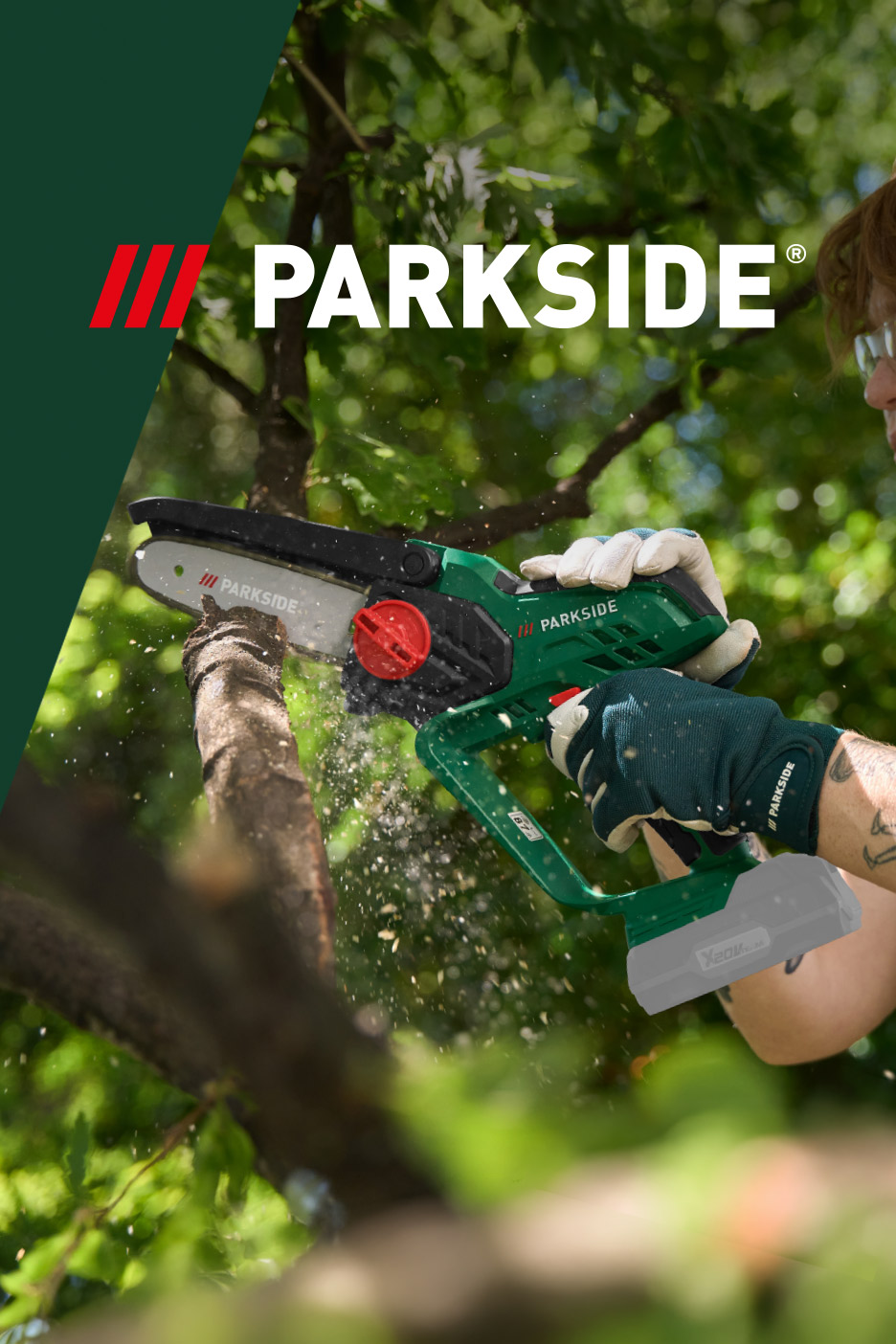 A person using a cordless garden pruner to cut a tree branch.