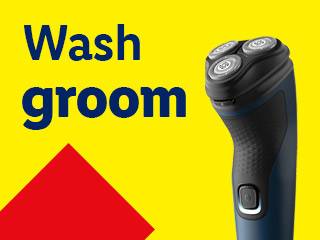 Electric shaver with text 'Wash groom' on a yellow background with a red triangle.