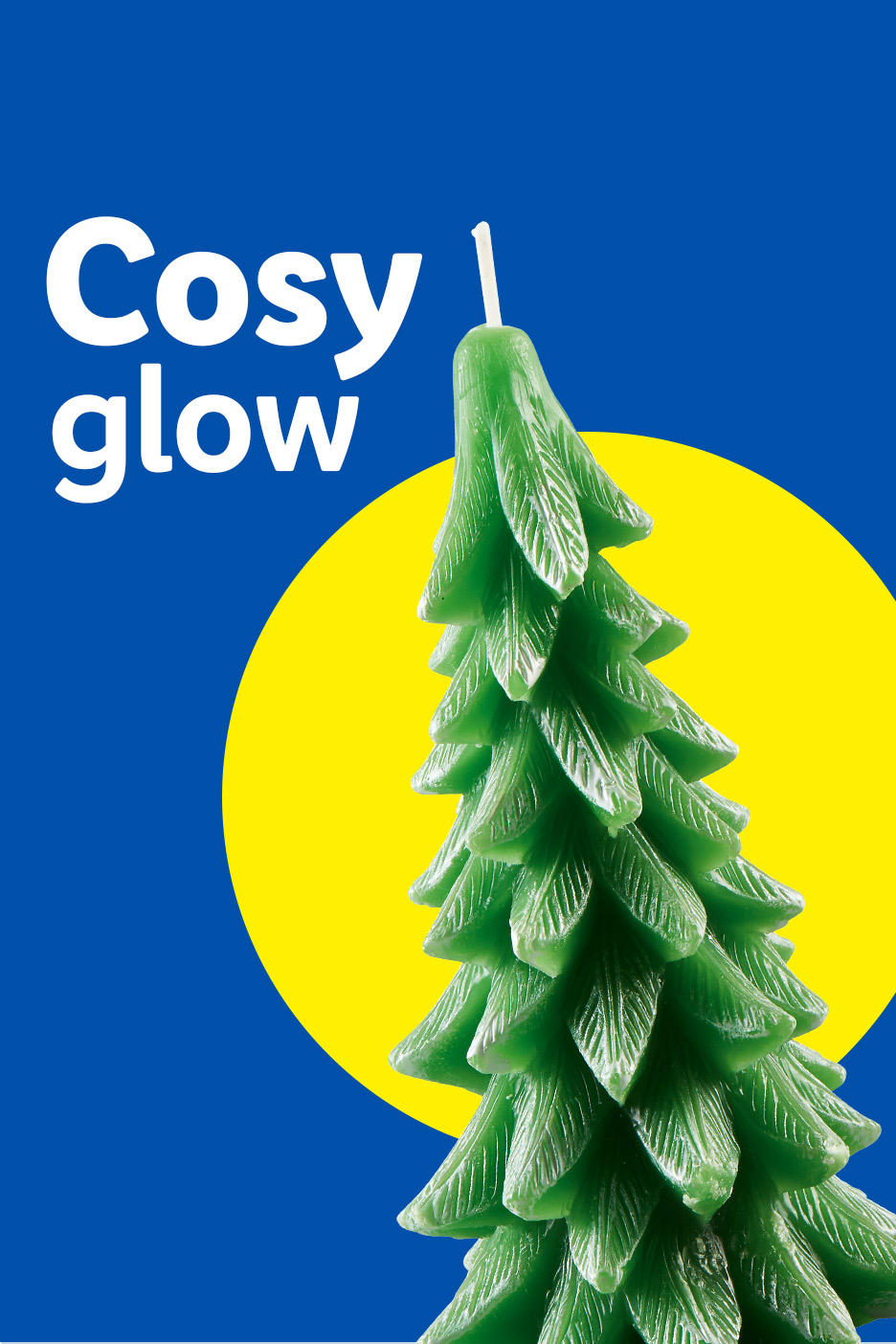 Green Christmas tree candle with 'Cosy glow' text on a blue and yellow background.