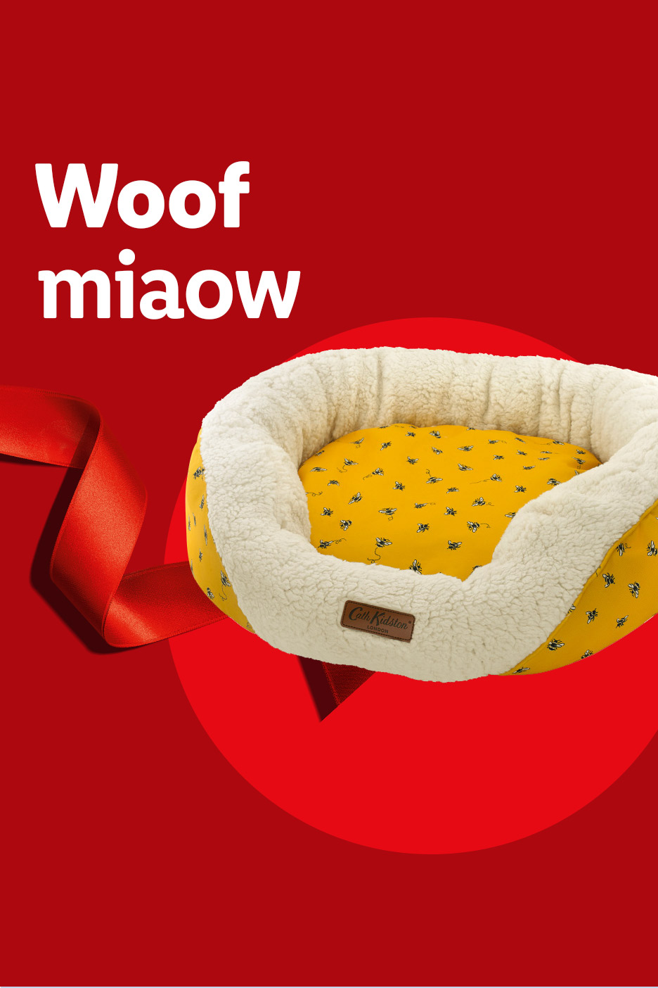 Yellow pet bed with white fleece lining and 'Woof miaow' text on a red background.