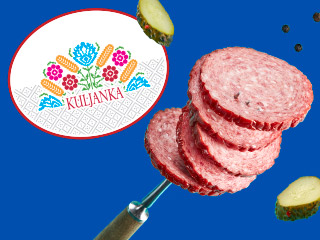 Kuljanka brand salami slices on a fork with pickles.