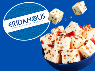 Eridanous Original Greek Product: Cubes of spicy feta cheese in a blue bowl.