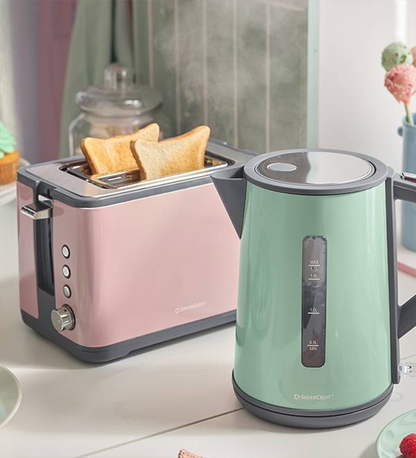 SilverCrest toaster with toast and kettle in a kitchen setting.