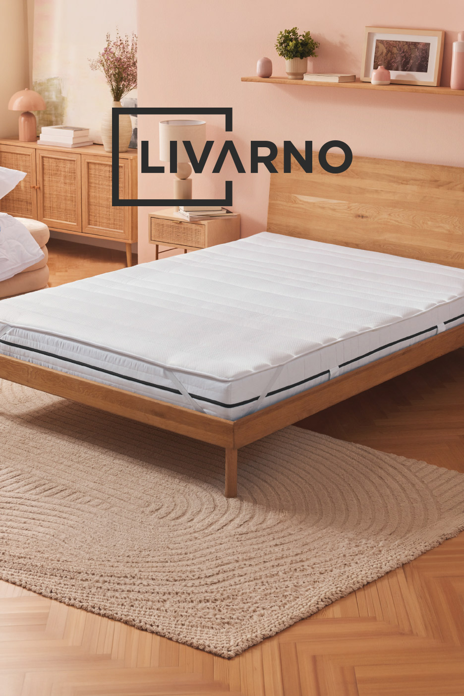Bedroom with wooden bed frame, white mattress, and beige rug. Text: LIVARNO.
