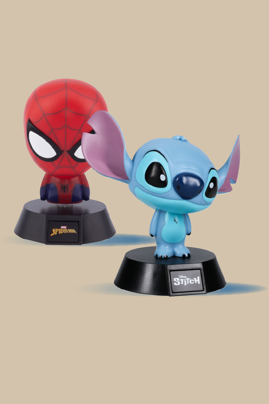 Two character night lights: a red superhero and a blue alien, on black bases.