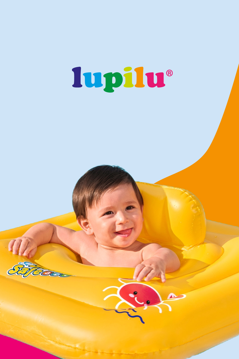 Happy baby in a yellow inflatable swim float with a crab design, smiling at the camera.